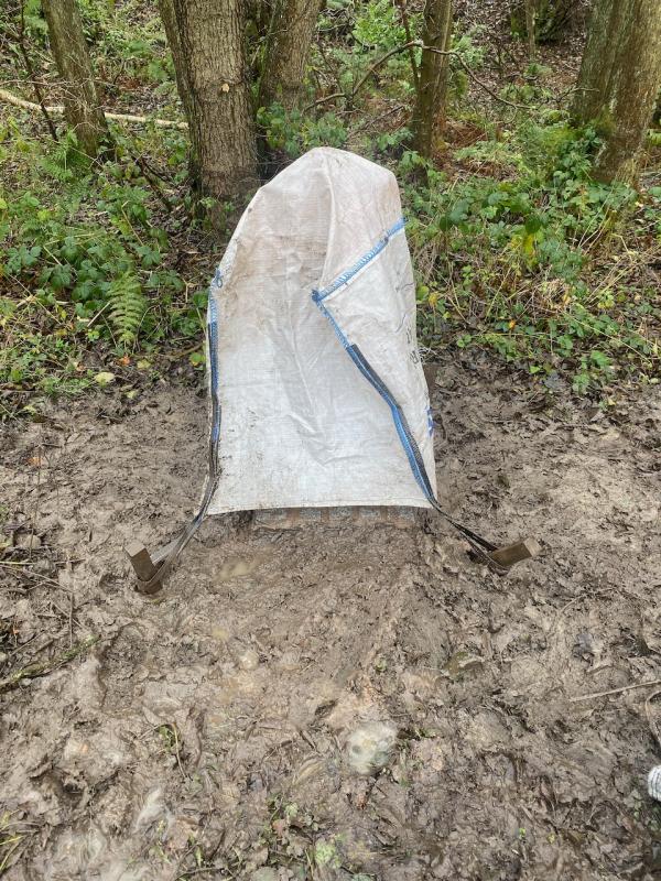 Milepost covered after plinth installation on a muddy day. November 2019