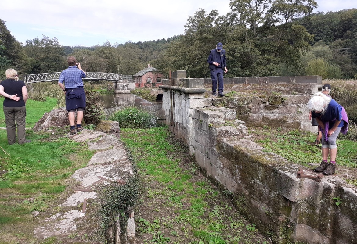 Visitors at Crumpwood inspect the remains of the flood lock